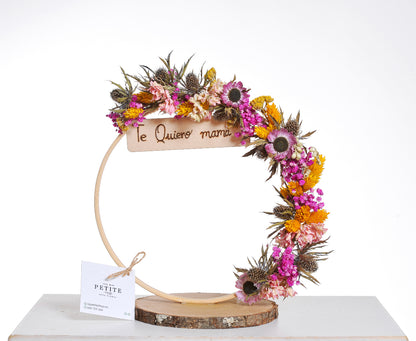 Corona floral colorida con mensaje personalizado
